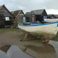 A boat is reflected in a puddle, Eye Karate Kamp, Southwold Harbour, Suffolk - 6th July 2024