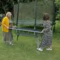 Megan and Sarah move a table around, Lane's End Festival, Bressingham, Norfolk - 14th July 2024