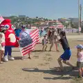 An Olympic mascot does a photo with some USA fans, Hannah and Olympic ILCA 6 Sailing, Marseille, France - 5th August 2024