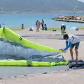 A surfer packs away the kite, Hannah and Olympic ILCA 6 Sailing, Marseille, France - 5th August 2024