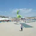 A kite is wrangled in the arena, Hannah and Olympic ILCA 6 Sailing, Marseille, France - 5th August 2024