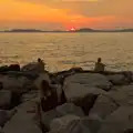 People on the rocks watch the setting sun, Olympic Non-Sailing, Notre Dame, and the Journey Home, Marseille, France - 8th August 2024