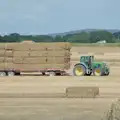 A tractor hauls around straw bales, Olympic Non-Sailing, Notre Dame, and the Journey Home, Marseille, France - 8th August 2024