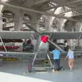 A biplane is worked on, Flying in a Dragon Rapide, IWM Duxford, Cambridgeshire - 17th August 2024