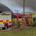 There's some sort of fire-fighter huddle, A Major Fire at Suffolk Highways, Brome, Suffolk - 15th September 2024