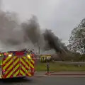 A fire engine partially blocks the road, A Major Fire at Suffolk Highways, Brome, Suffolk - 15th September 2024