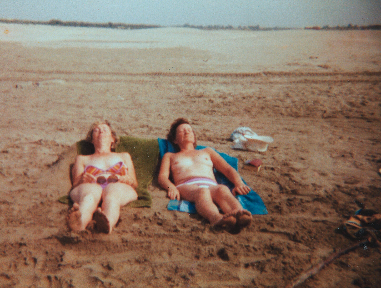 Jean and Pam catch a few rays on the beach from Camping with Sean, The Camargue, South of France, 15th July 1982