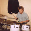 Nosher plays the drums (probably along to live Genesis)