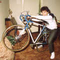 Sean rides Nosher's bike in his lounge