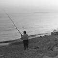 Some dude fishes off Barton beach, Life in Ford Cottage and Barton on Sea, Hampshire - 2nd April 1985