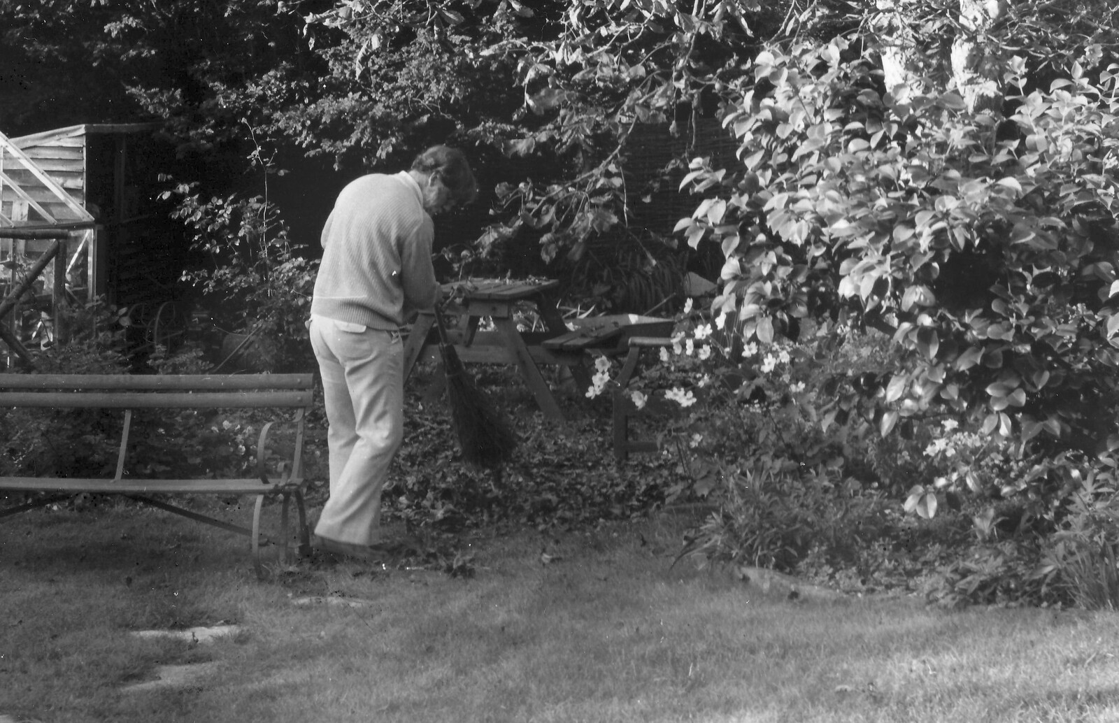 Andy Campbell sweeps leaves up from Life in Ford Cottage and Barton on Sea, Hampshire - 2nd April 1985