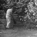 Andy Campbell sweeps leaves up, Life in Ford Cottage and Barton on Sea, Hampshire - 2nd April 1985