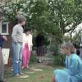 1985 People mill around playing croquet