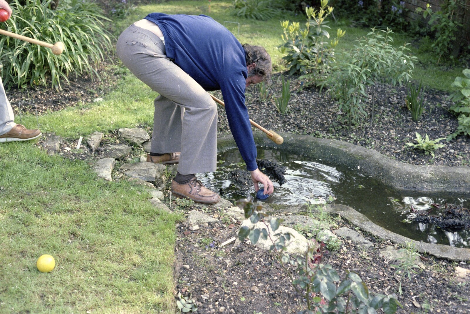Nosher's 18th Birthday, Barton on Sea, Hampshire - 26th May 1985: Andy picks a croquet ball out of the pond
