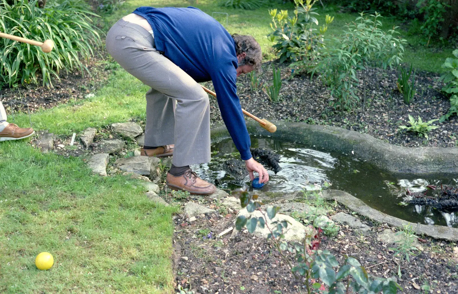 Andy picks a croquet ball out of the pond, from Nosher's 18th Birthday, Barton on Sea, Hampshire - 26th May 1985
