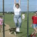 Anna swings from the monkey bars, Brockenhurst College Exams and Miscellany, Barton on Sea, Hampshire - 10th June 1985