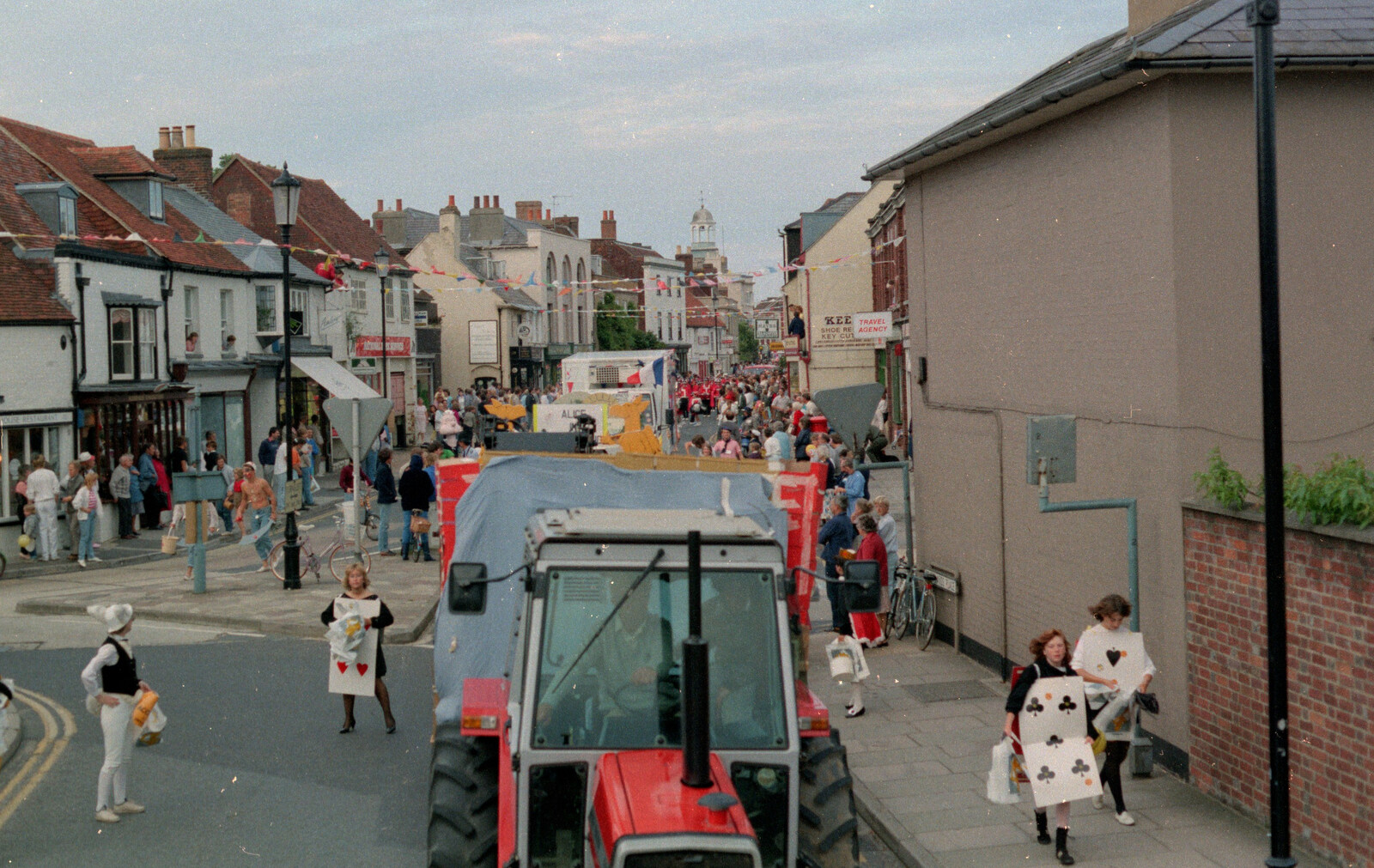 A tractor and a bunch of milling playing cards at the top of the High Street from The Lymington Carnival, Hampshire - 17th June 1985