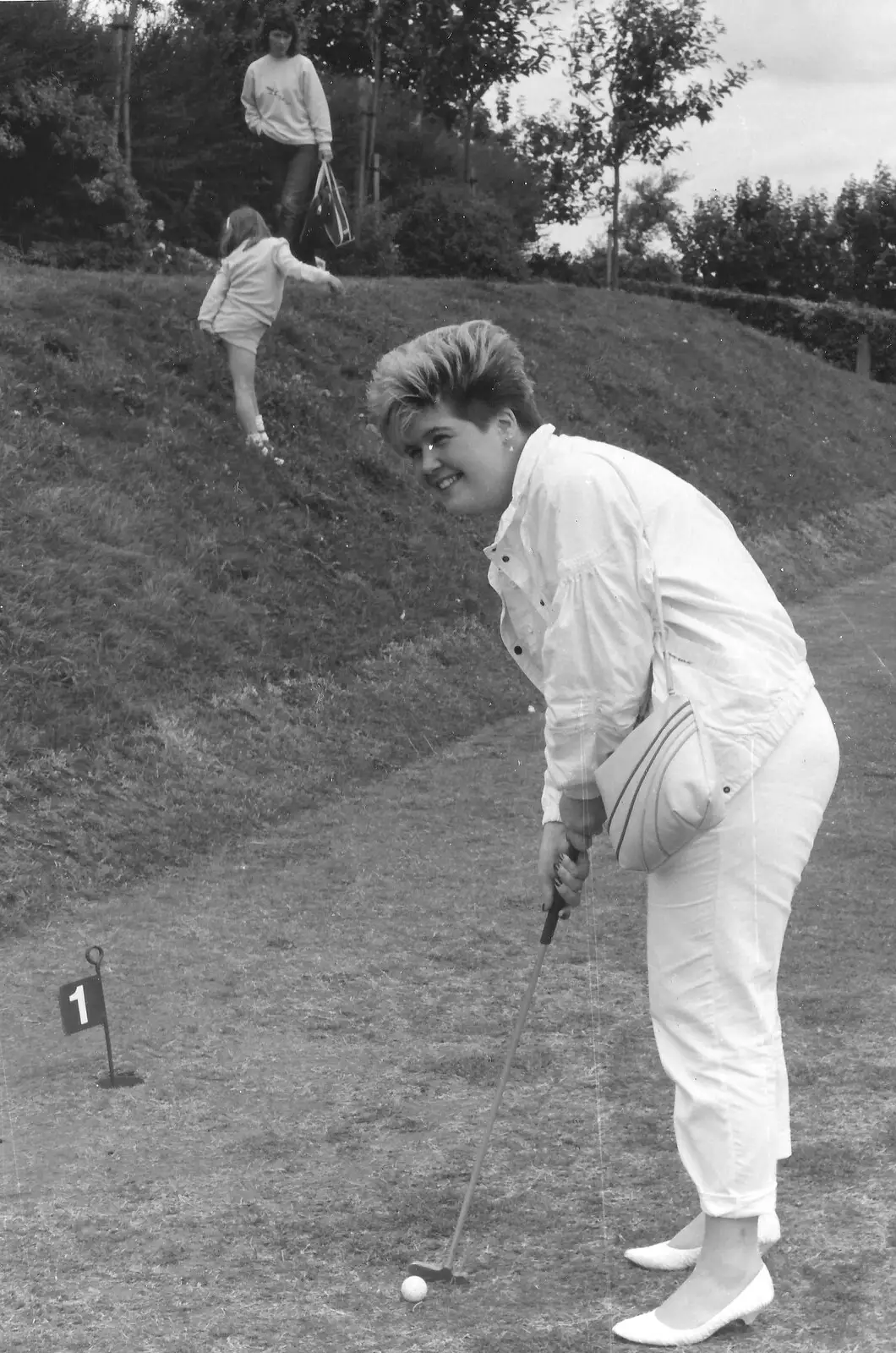 Carol and Nosher do some crazy golf, from Phil's Birthday and Newlands Camping, Charmouth and Hordle, Dorset and Hampshire - 7th August 1985