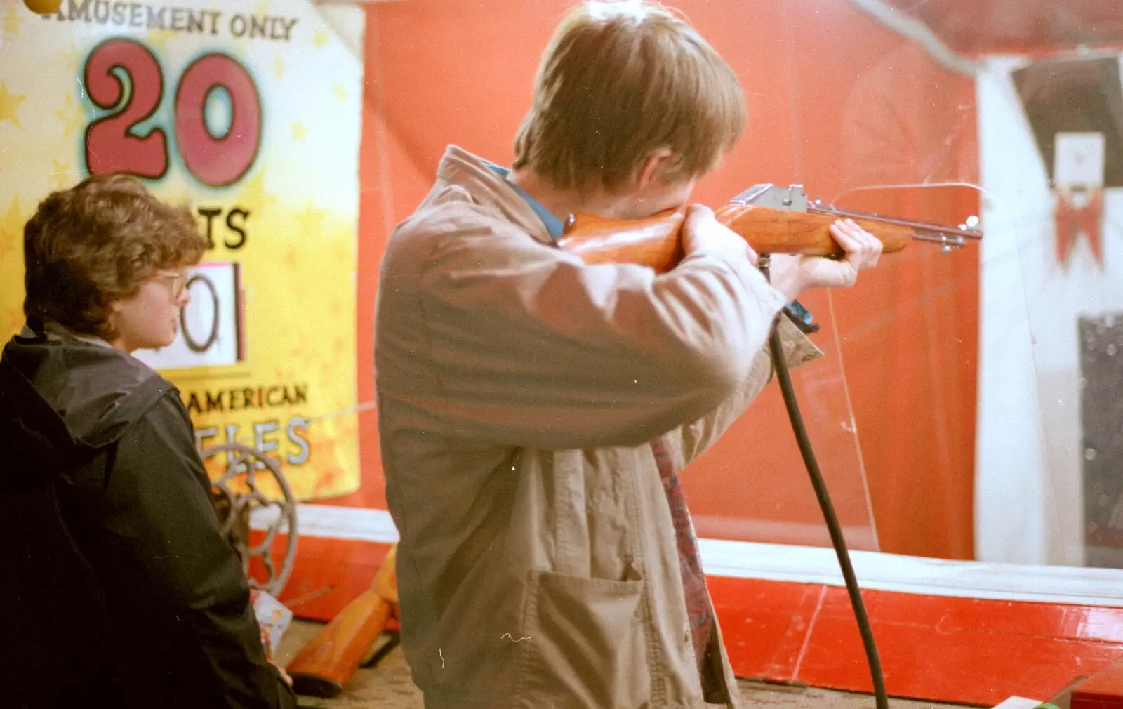 Malcolm on the air rifles, from Uni: A Central Park Fair and City Street Life, Plymouth - 20th October 1985