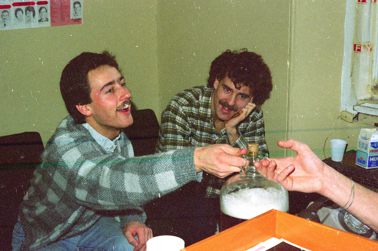 Mark passes over a demijohn of homebrew from Uni: The Fly Christmas Party and BABS Panto, Plymouth Polytechnic, Devon - December 11th 1985