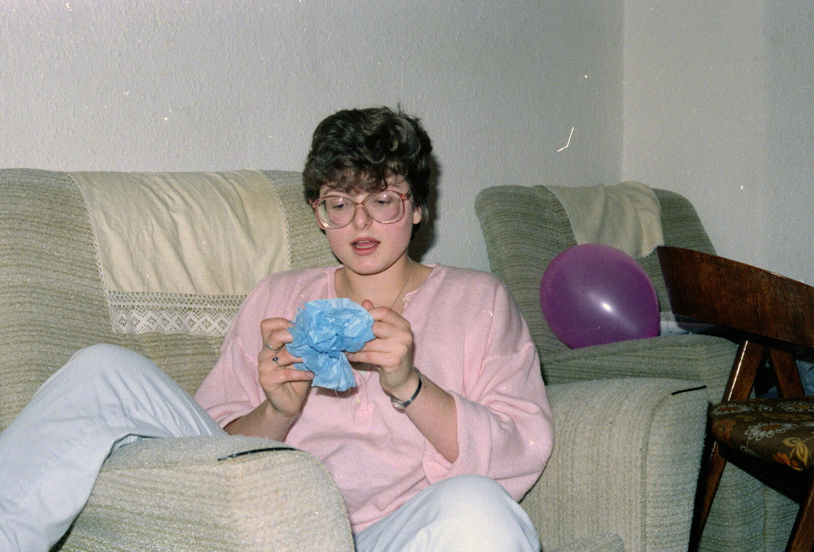 Barbara considers a crepe flower from Uni: Beaumont Street Decorations and Water Fight, Plymouth - 14th December 1985