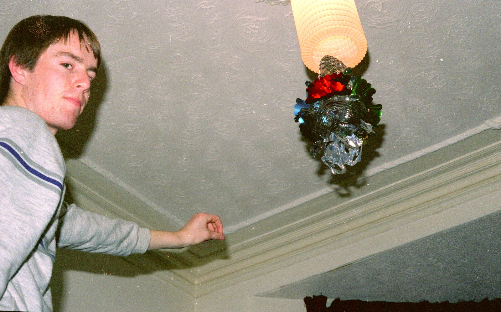 Malcom sticks a decoration on the light from Uni: Beaumont Street Decorations and Water Fight, Plymouth - 14th December 1985