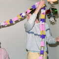 Malcom hangs up a crepe-paper streamer, Uni: Beaumont Street Decorations and Water Fight, Plymouth - 14th December 1985