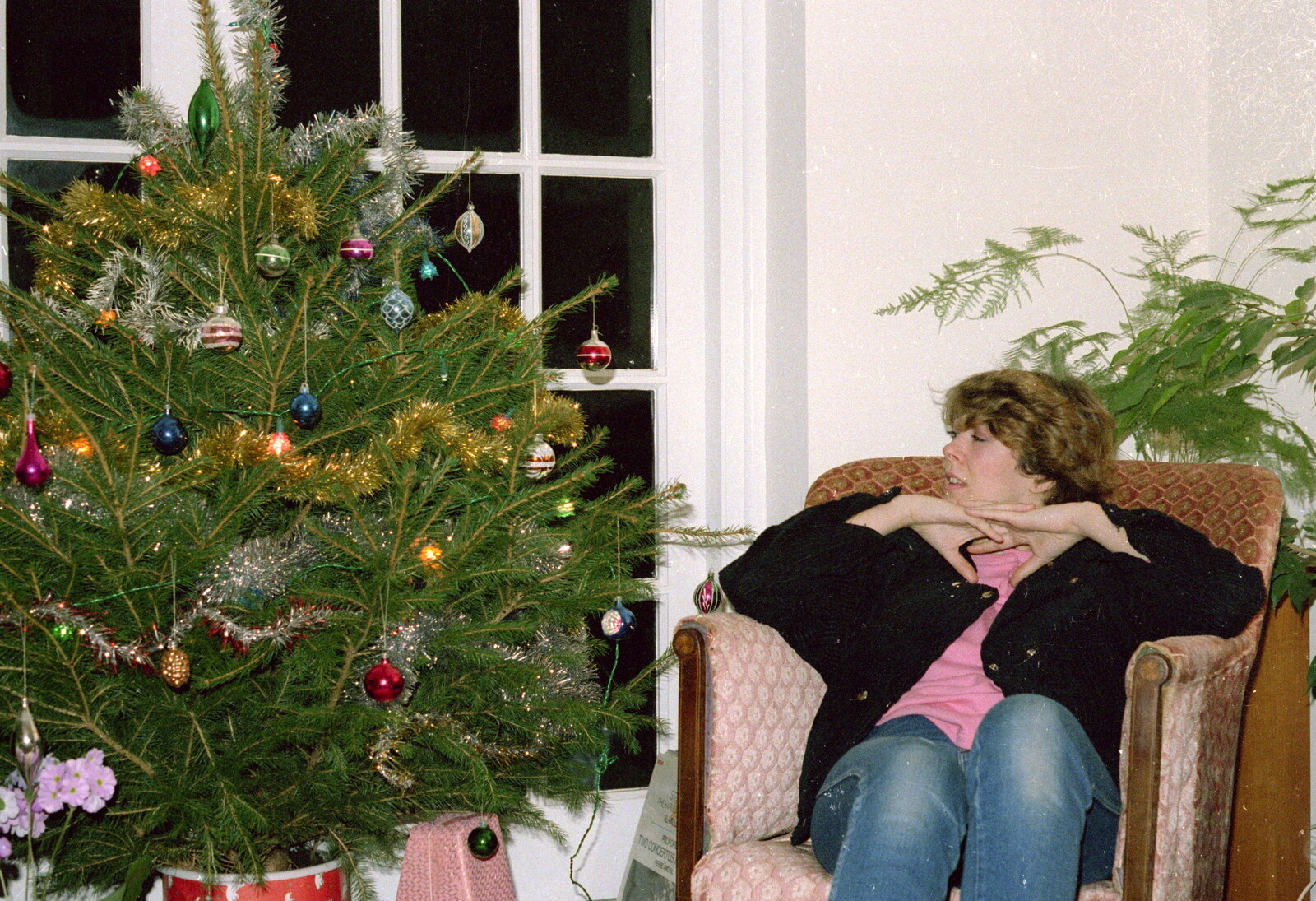Helen considers the Christmas tree from Brockenhurst College Presentation and Christmas, Hampshire - 19th December 1985