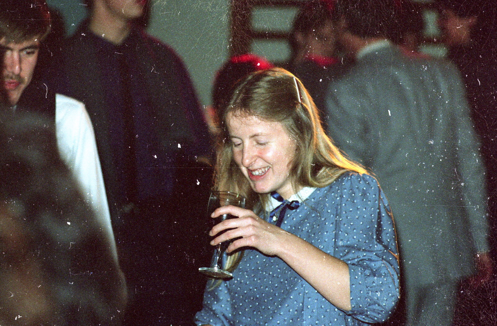 Helen Malin looks at her wine from Brockenhurst College Presentation and Christmas, Hampshire - 19th December 1985