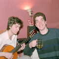 Sean plays guitar as Jon grins, Ford Cottage Pre-Christmas, Barton on Sea, Hampshire - 19th December 1985