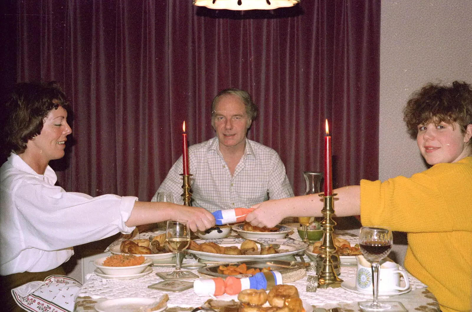 Maureen and Sis pull a cracker, from Christmas in Macclesfield and Wetherby, Cheshire  and Yorkshire - 25th December 1985