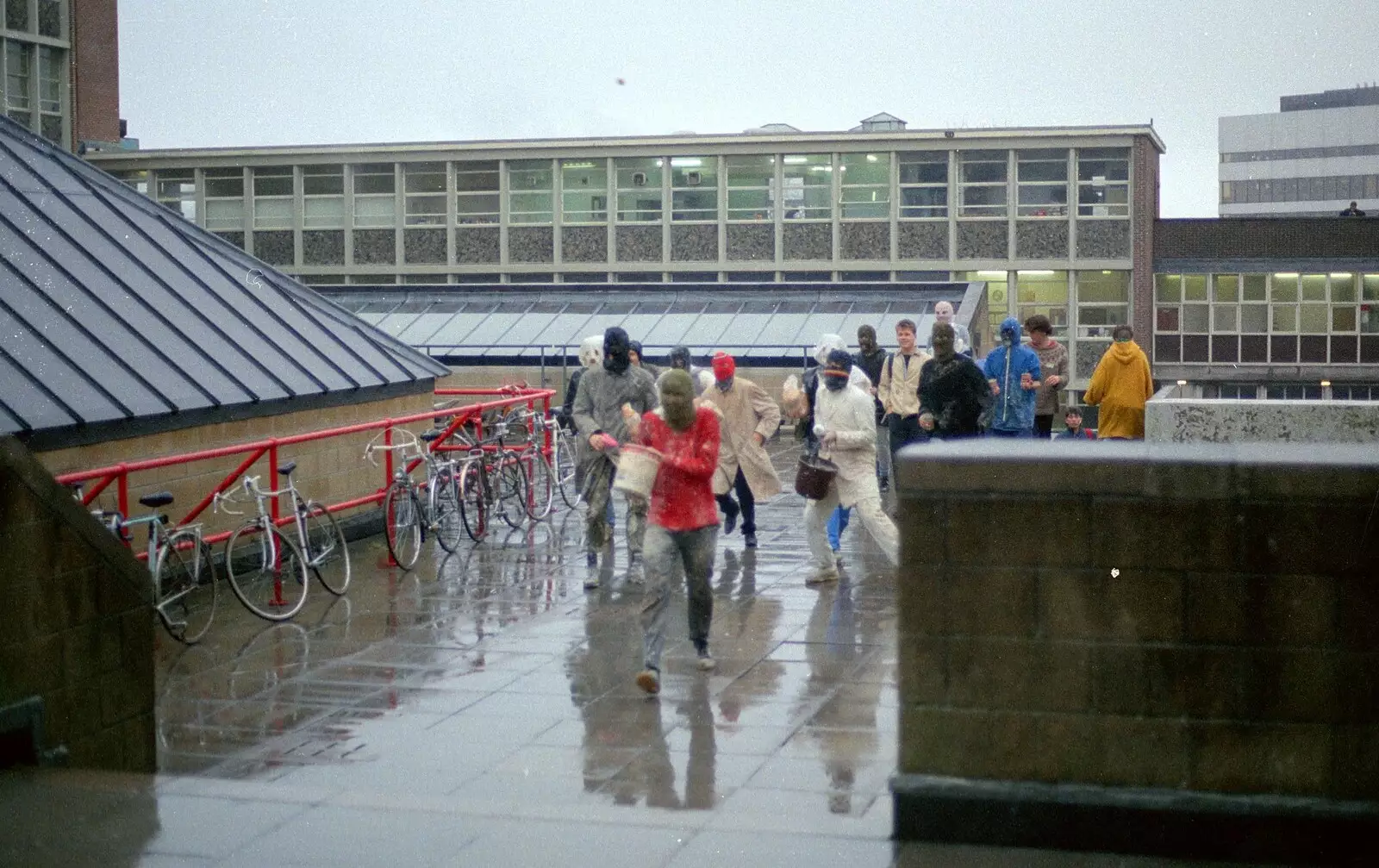 The Hit Squad runs up from the Engineering Block armed with buckets, from Uni: The Jazz RAG Hit Squad, Plymouth Polytechnic, Devon - 8th February 1986