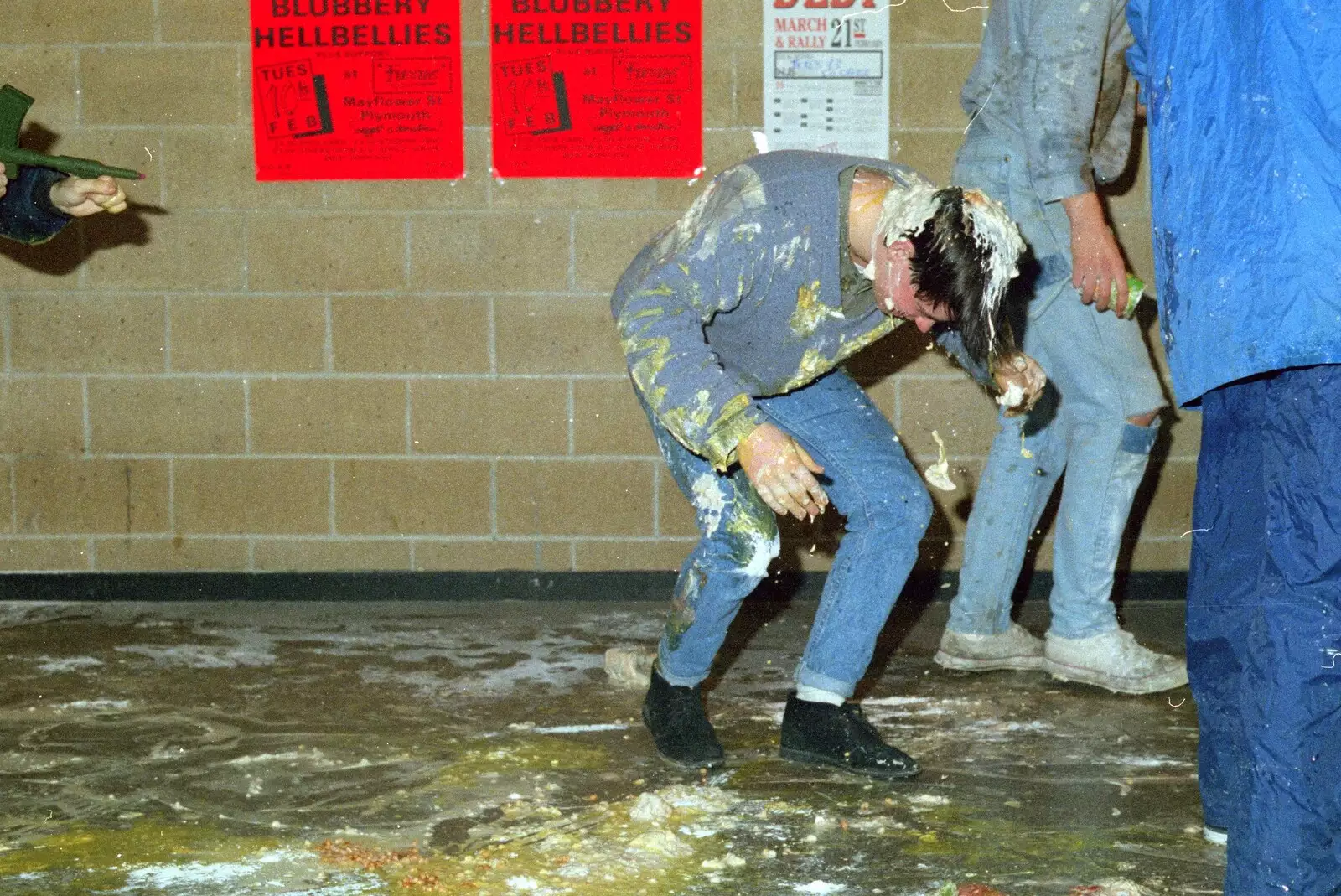 A victim struggles to stand up under the weight of goo, from Uni: The Jazz RAG Hit Squad, Plymouth Polytechnic, Devon - 8th February 1986