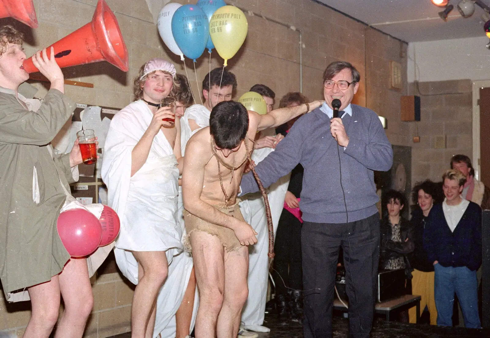 Rich Arnold uses his cone as a megaphone, from Uni: The PPSU "Jazz" RAG Review and Charity Auction, Plymouth, Devon - 10th February 1986