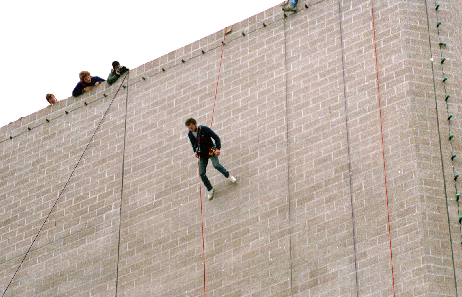 An abseiler walks down the walls of the theatre from Uni: RAG Week Abseil, Hitch Hike, and Beaumont Street Life Plymouth, Devon - 13th February 1986