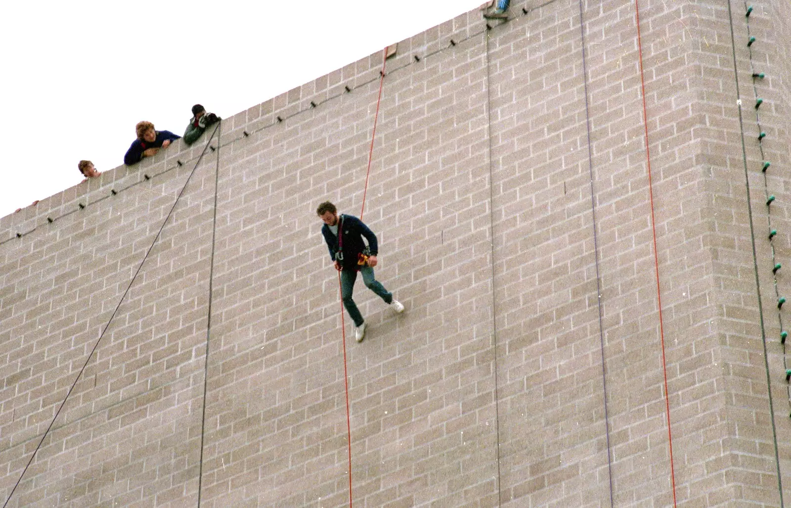 An abseiler walks down the walls of the theatre, from Uni: RAG Week Abseil, Hitch Hike, and Beaumont Street Life Plymouth, Devon - 13th February 1986