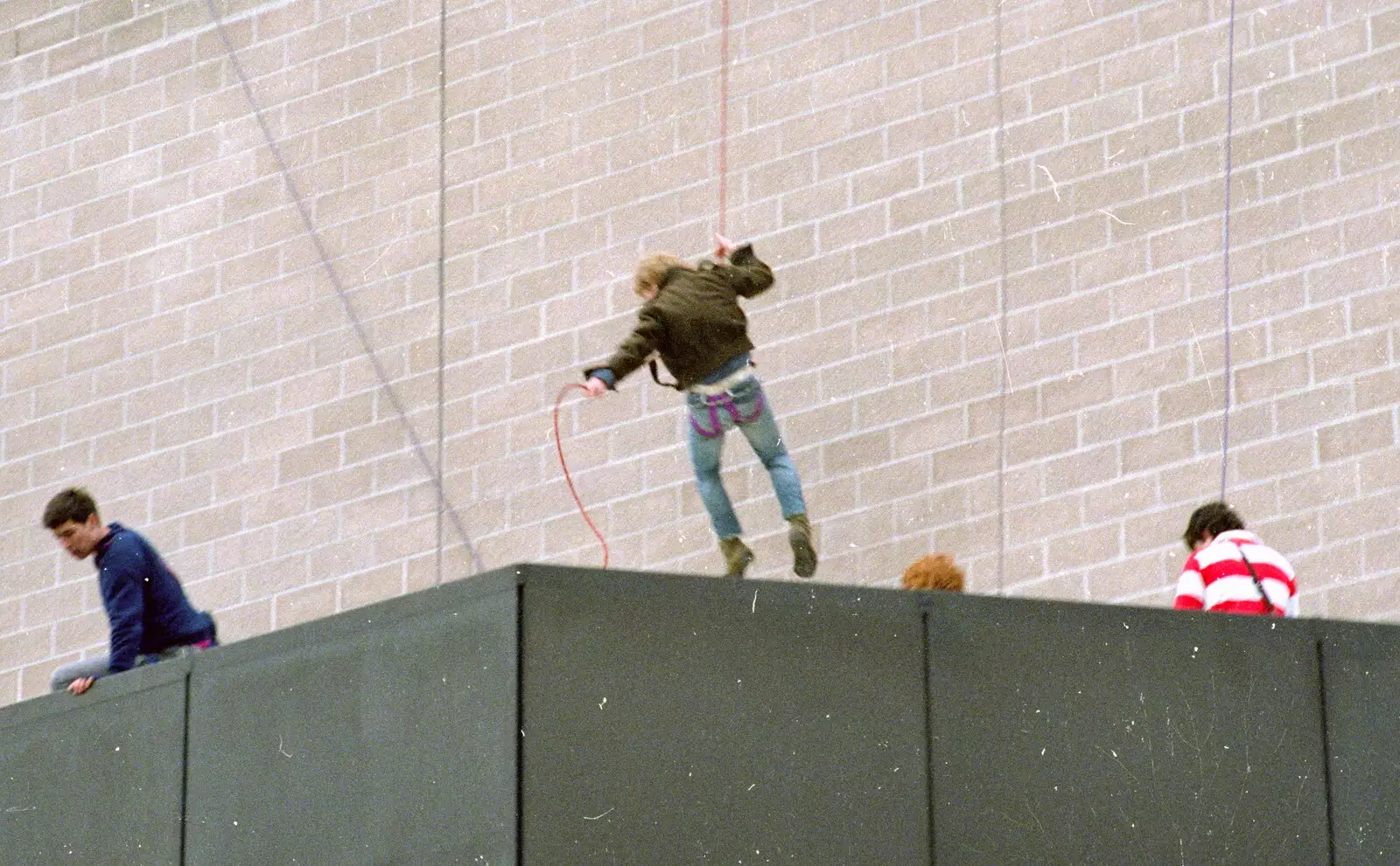 A gentle landing, from Uni: RAG Week Abseil, Hitch Hike, and Beaumont Street Life Plymouth, Devon - 13th February 1986