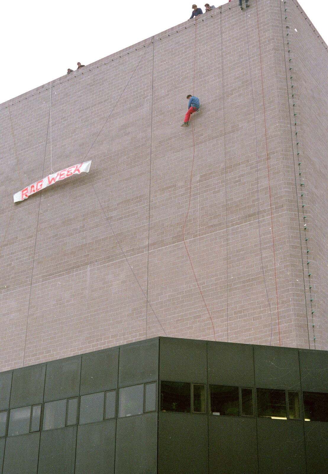 A RAG week sign is hung up on the Theatre Royal from Uni: RAG Week Abseil, Hitch Hike, and Beaumont Street Life Plymouth, Devon - 13th February 1986