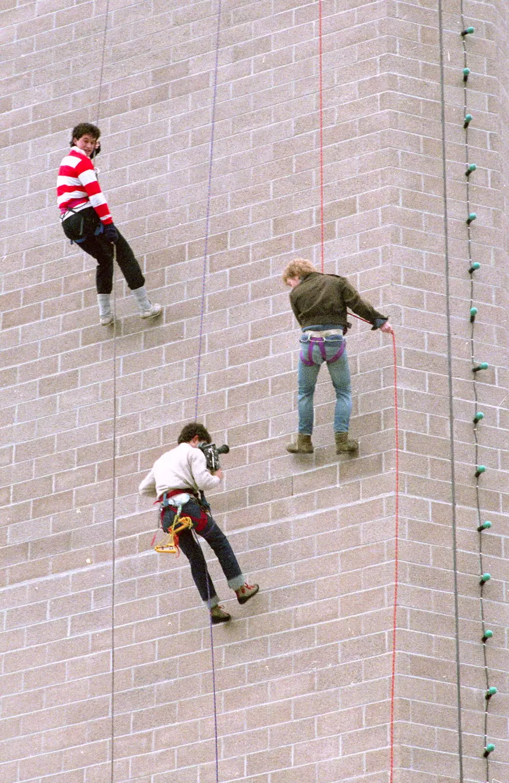 An SUTV videographer films the abseiling on the way down, from Uni: RAG Week Abseil, Hitch Hike, and Beaumont Street Life Plymouth, Devon - 13th February 1986