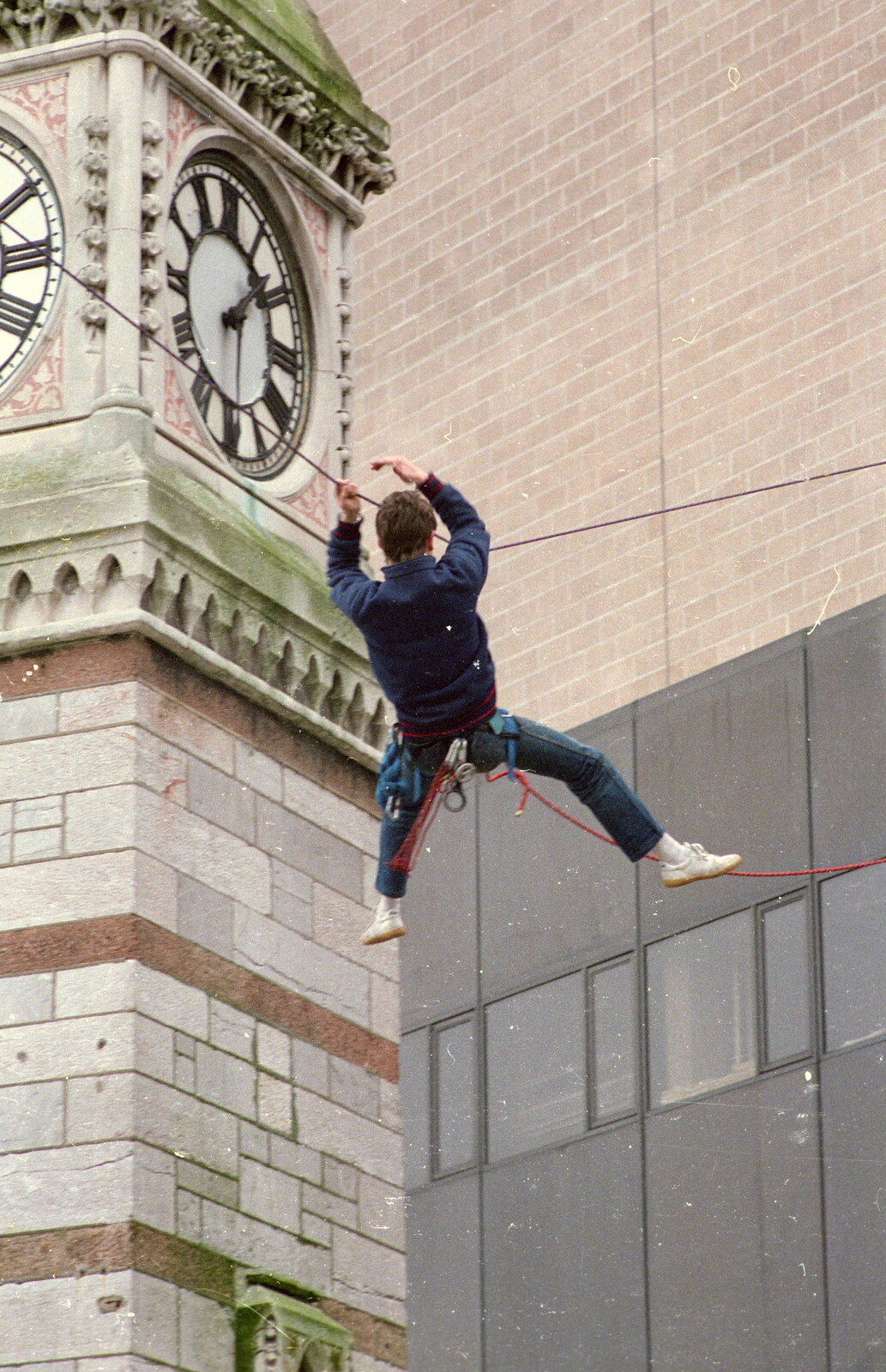 An abseiler hangs around near the clock tower from Uni: RAG Week Abseil, Hitch Hike, and Beaumont Street Life Plymouth, Devon - 13th February 1986