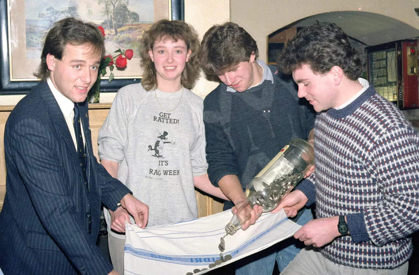 Coins are tipped out, from Uni: RAG Week Abseil, Hitch Hike, and Beaumont Street Life Plymouth, Devon - 13th February 1986