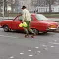 A dude on rollerskates chases down a Ford Escort, Uni: PPSU "Jazz" RAG Street Parade, Plymouth, Devon - 17th February 1986