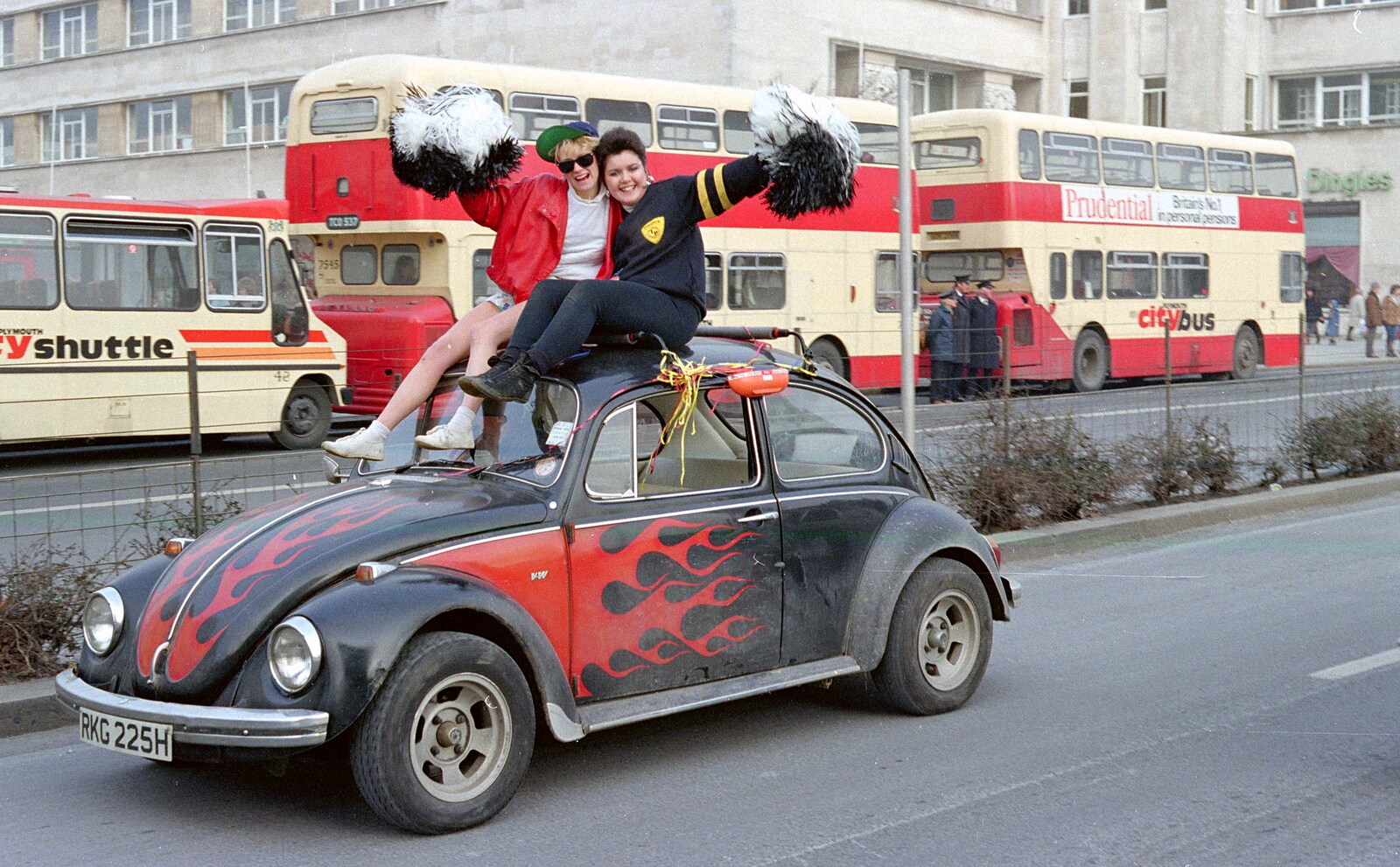 A couple of BABS girlies on a flamed-up Beetle from Uni: PPSU "Jazz" RAG Street Parade, Plymouth, Devon - 17th February 1986