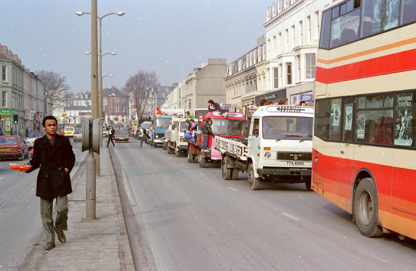 Simon Bento on the central resevation on Mutley Plain from Uni: PPSU "Jazz" RAG Street Parade, Plymouth, Devon - 17th February 1986