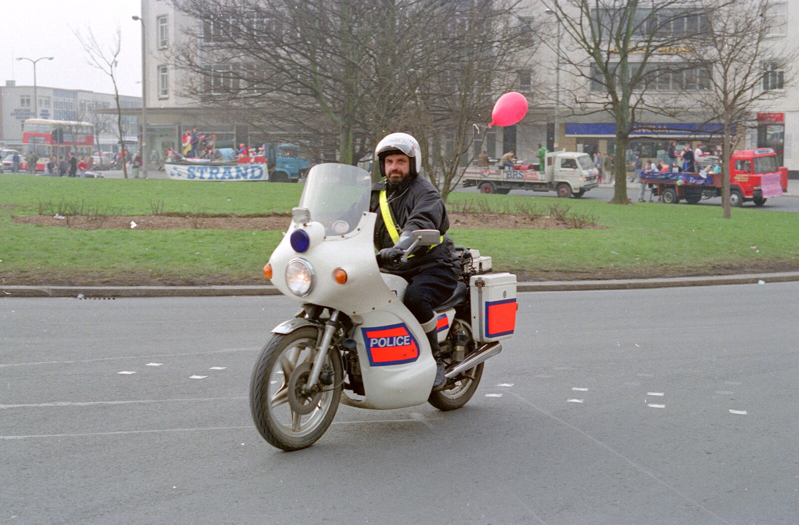 A motorbike rozzer keeps order from Uni: PPSU "Jazz" RAG Street Parade, Plymouth, Devon - 17th February 1986