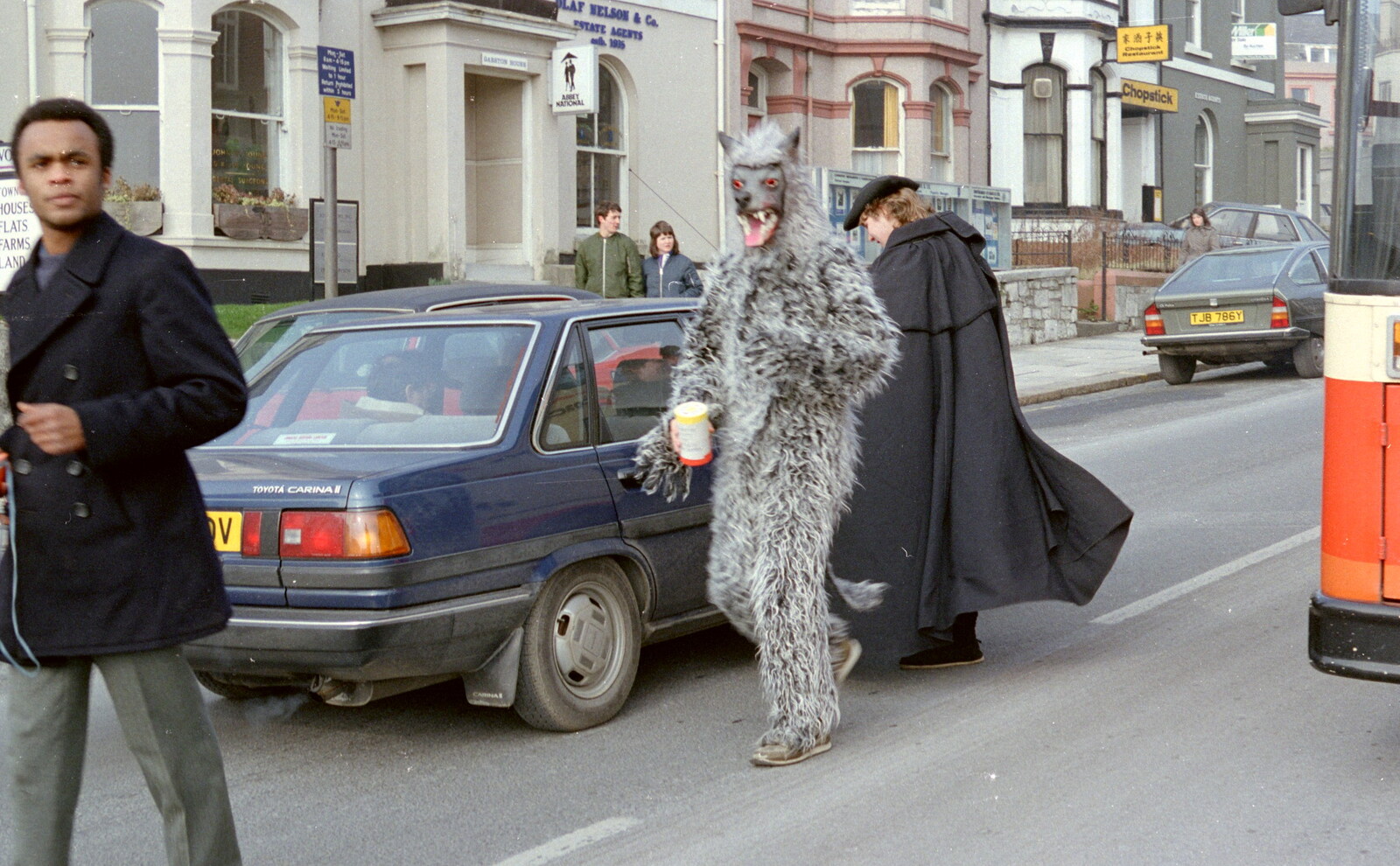A highwayman holds up a car on North Hill from Uni: PPSU "Jazz" RAG Street Parade, Plymouth, Devon - 17th February 1986