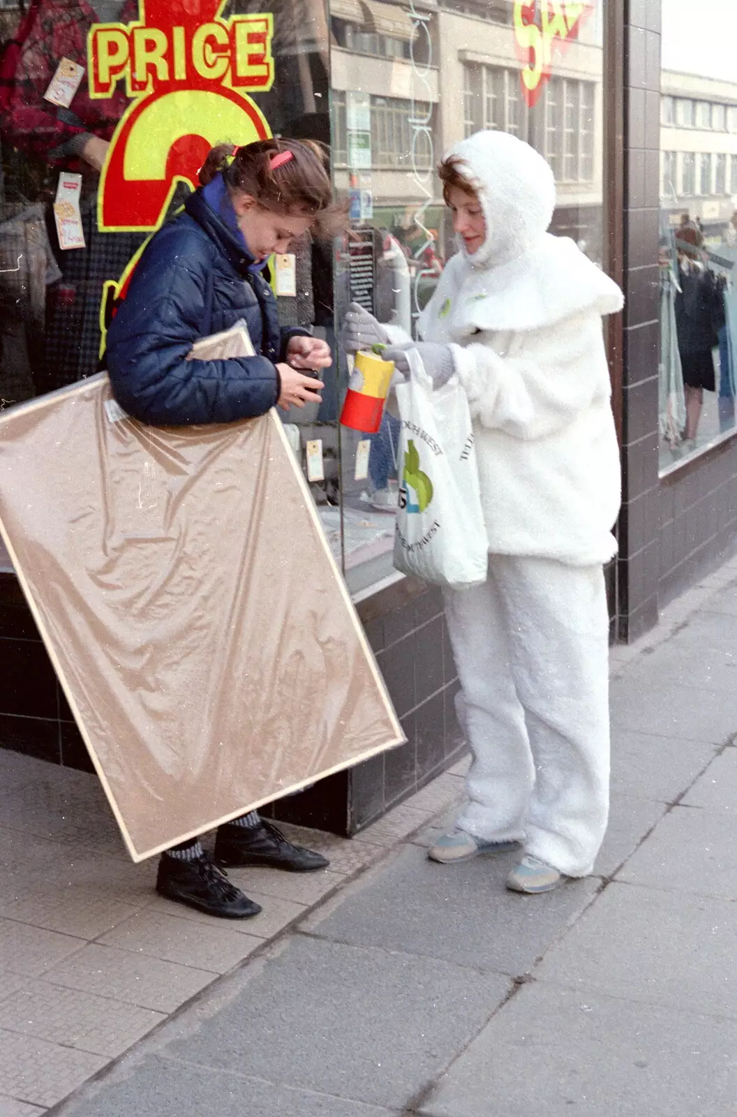 The Pierrot gets some change, from Uni: PPSU "Jazz" RAG Street Parade, Plymouth, Devon - 17th February 1986