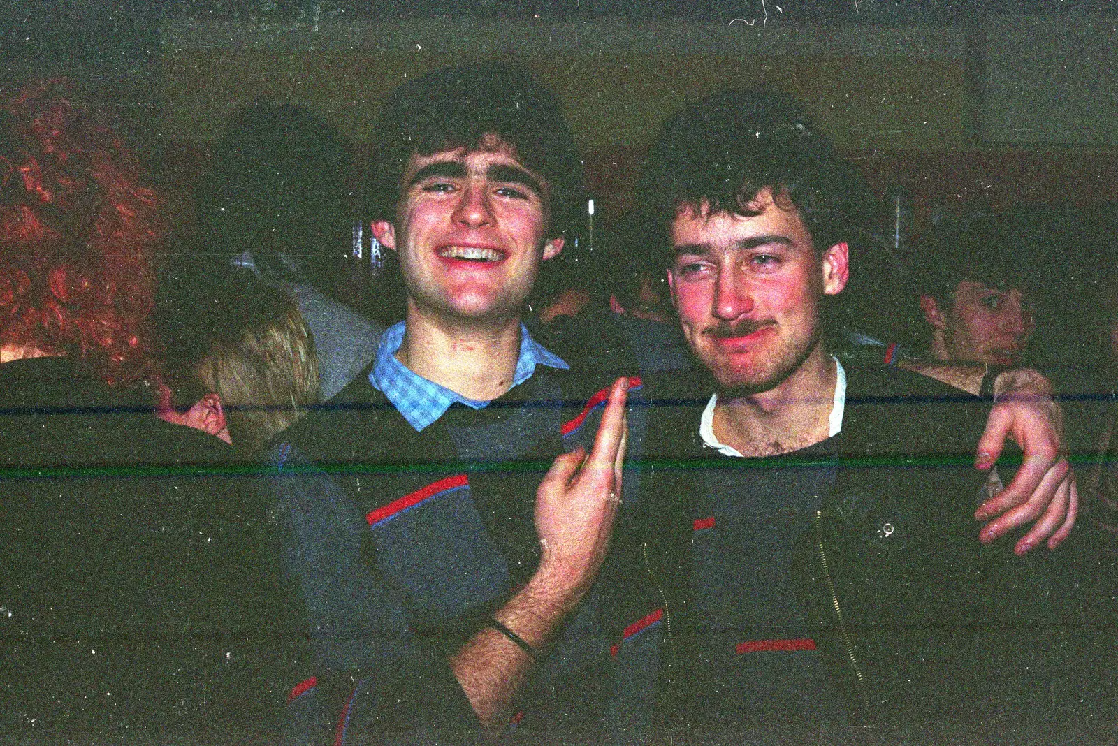 A dark Mark Wilkins gets two fingers, from Uni: Music Nights and the RAG Ball, Plymouth, Devon - 18th February 1986