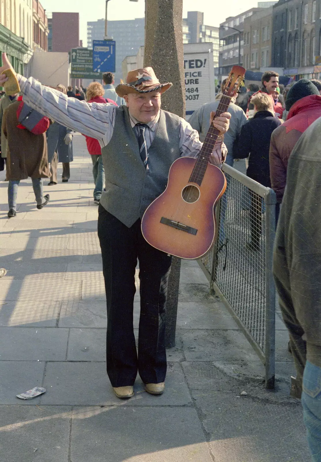 A dude with a guitar near Waterloo, from Uni: No Chance Fowler! A student Demonstration, London - 26th February 1986