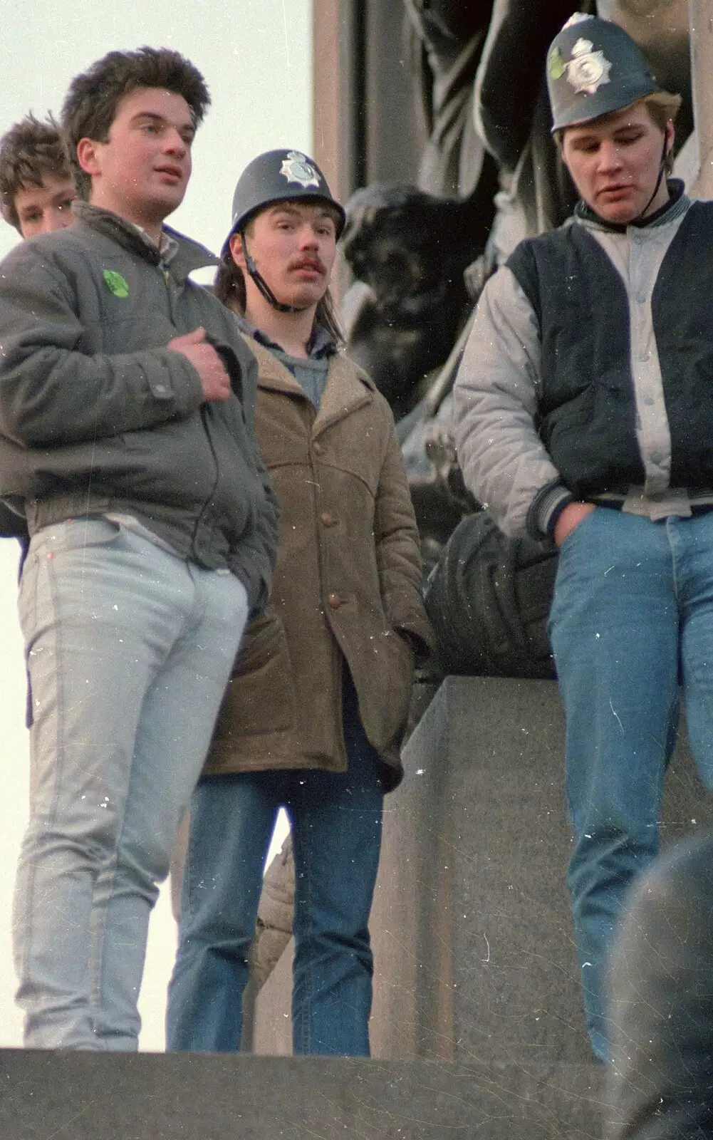 Students on Nelson's Column, with fake (?) police helmets, from Uni: No Chance Fowler! A student Demonstration, London - 26th February 1986